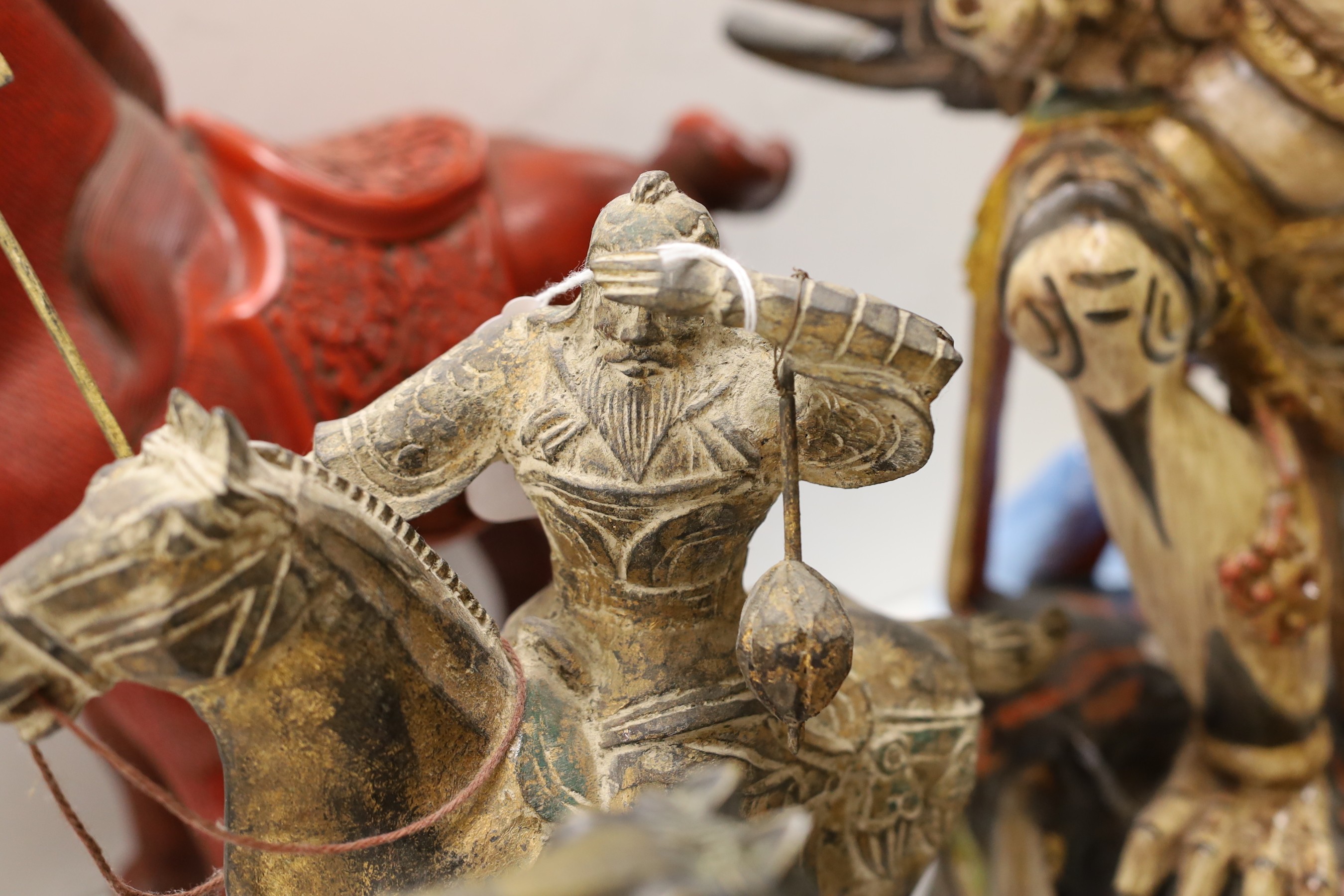 A quantity of south East Asian wood carvings including Chinese wood panels and an Indonesian carving of Garuda 80cm